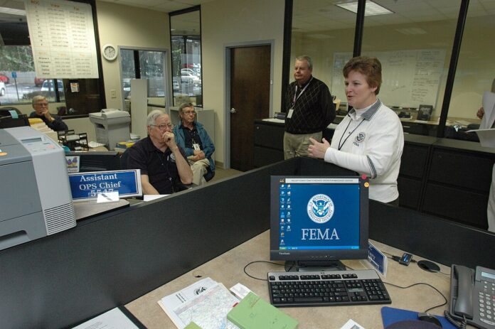 1280px-FEMA_-_34578_-_FEMA_FCO_meets_with_staff_in_Georgia