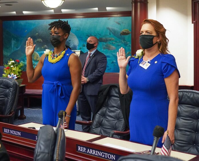 1280px-Newly_elected_House_members_Rep._Angie_Nixon_and_Rep._Kristen_Arrington,_are_sworn_in_by_Justice_Ricky_Polston_during_Organization_Session
